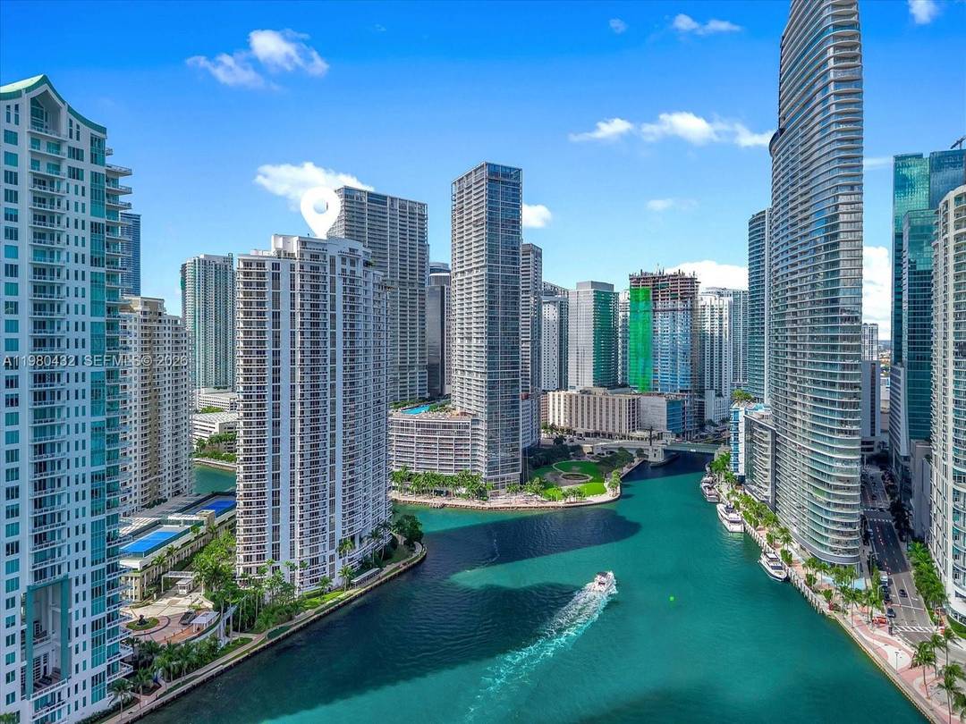Beautiful bright corner residence at Carbonell on prestigious Brickell Key, featuring a wrap around balcony with sweeping views of Biscayne Bay and the Miami skyline.