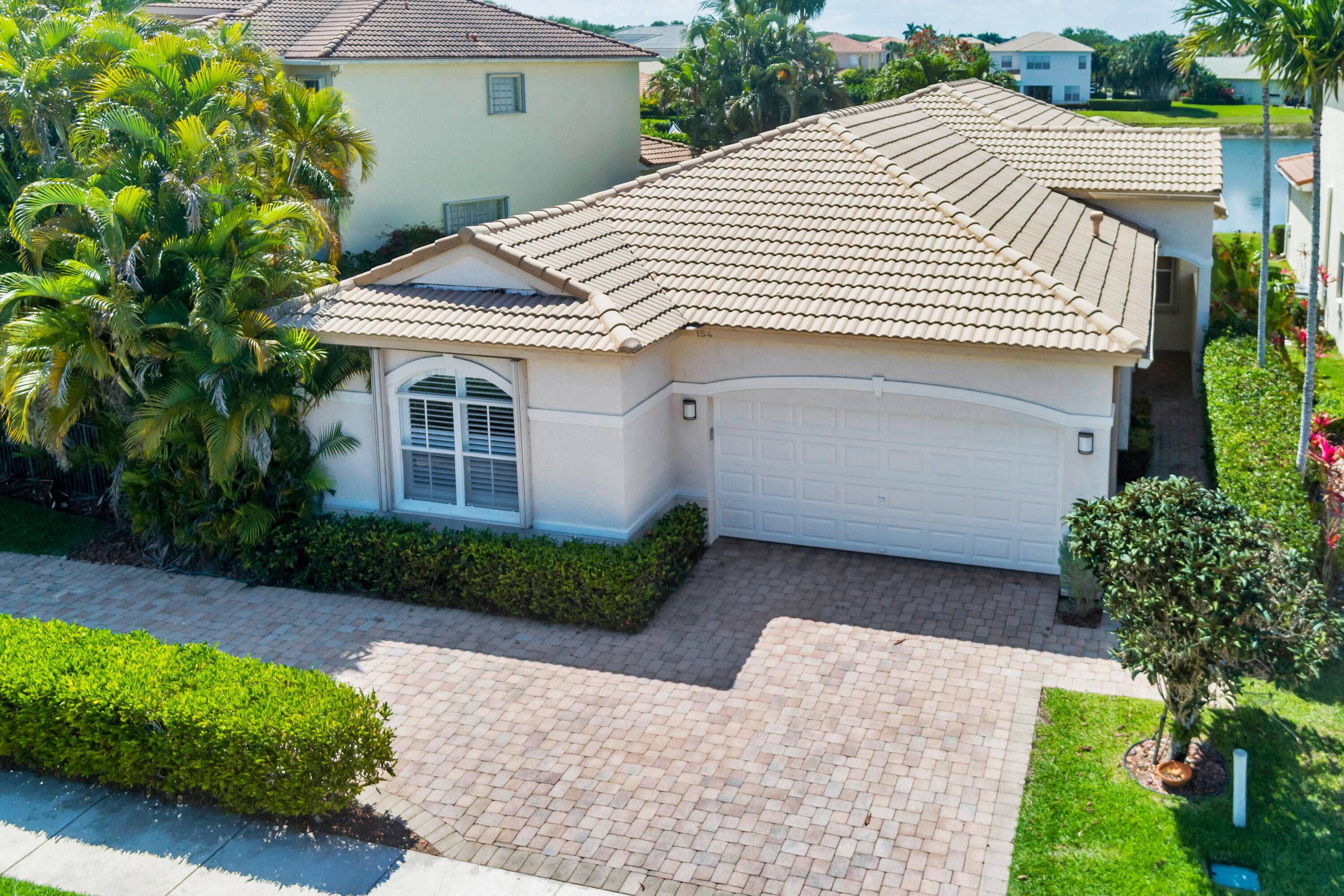 Priced to sell ! Located in the desirable gated community of Mirabella in Palm Beach Gardens, this exceptional 4 bedroom, 2.