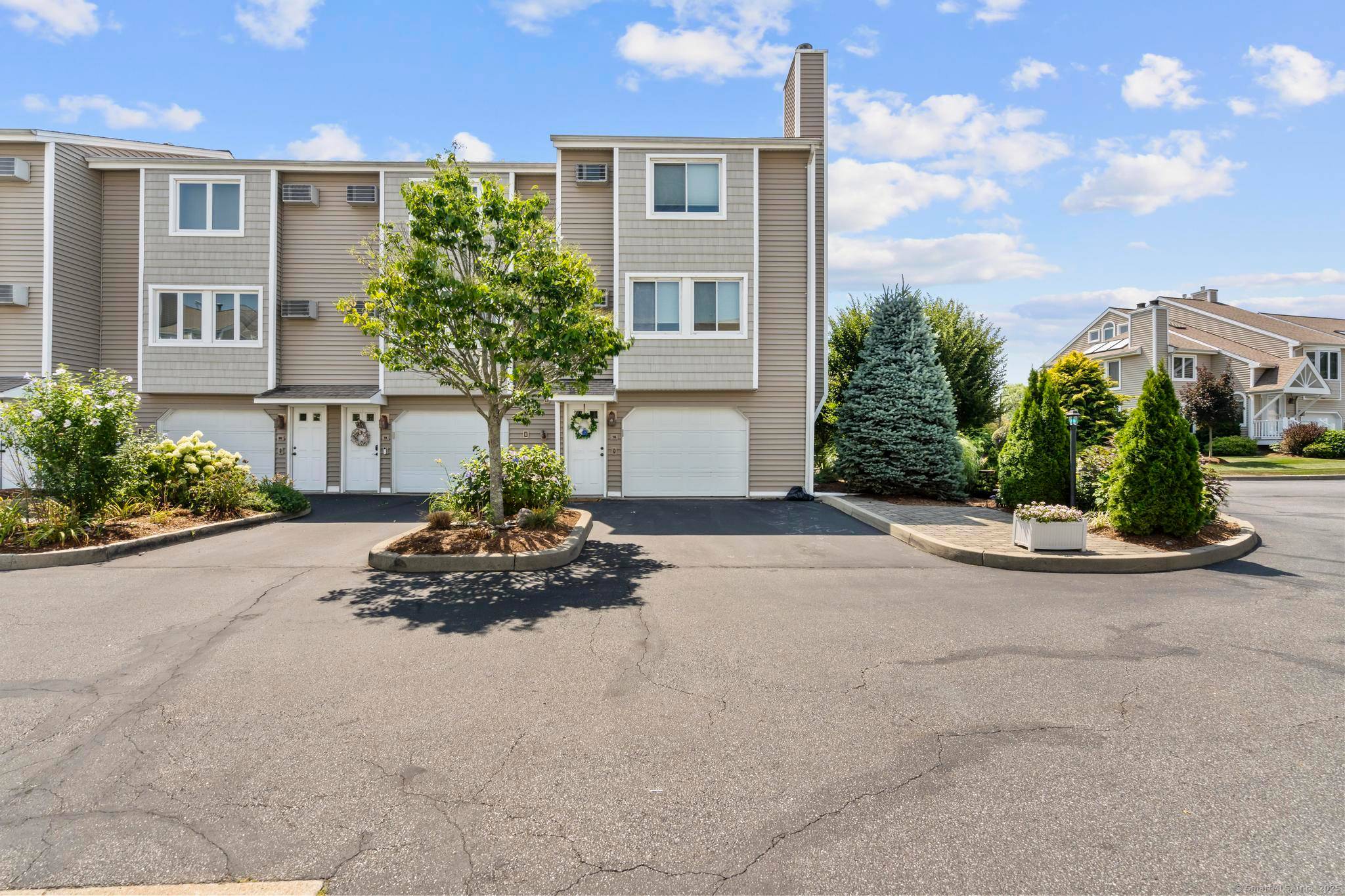 Welcome to 76 Merwin Avenue a completely renovated coastal townhome offering the ultimate blend of modern luxury and relaxed beachside living.
