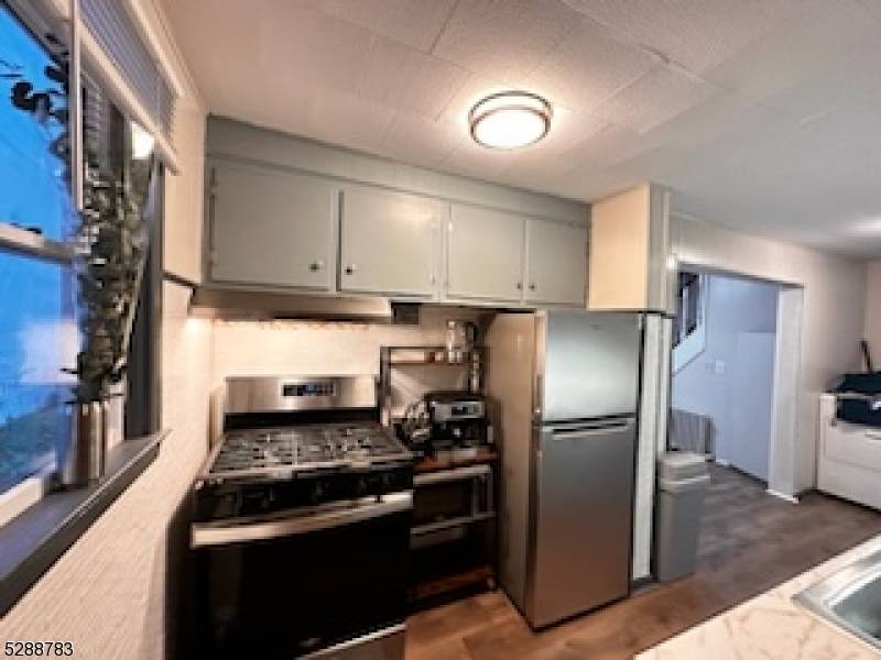 MOVE IN CONDITION HOME NESTLED ON A FLAT YARD.