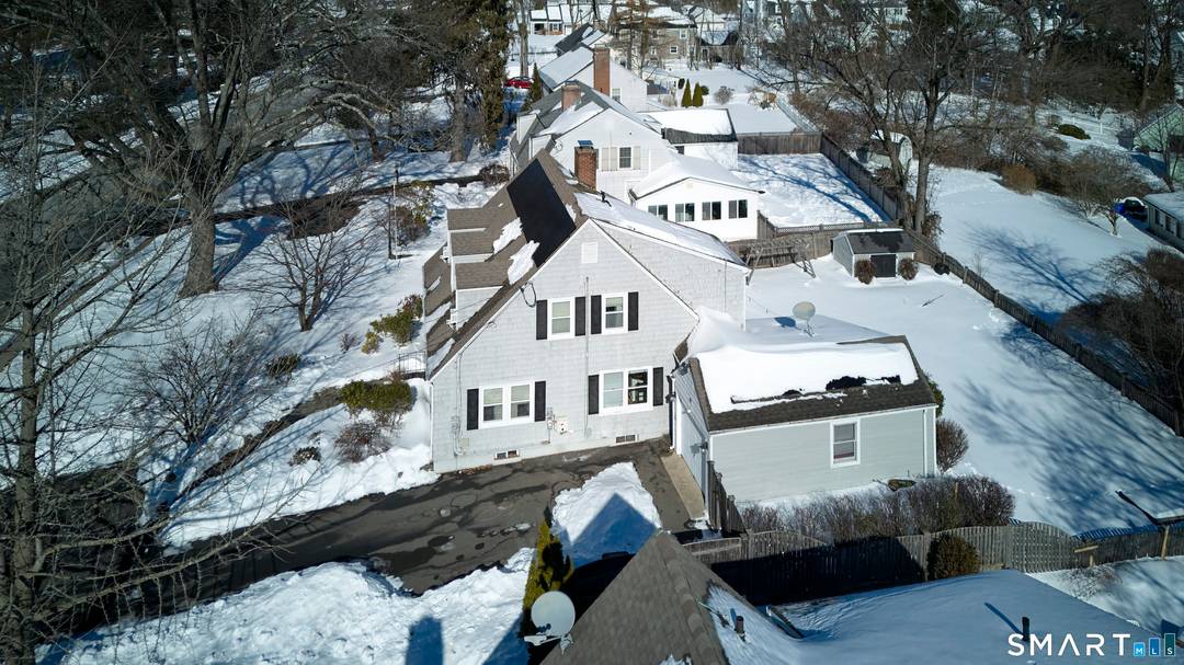 At first glance, it's a classic, quintessential New England Cape Cod home, replete with it's treble dog house dormers.