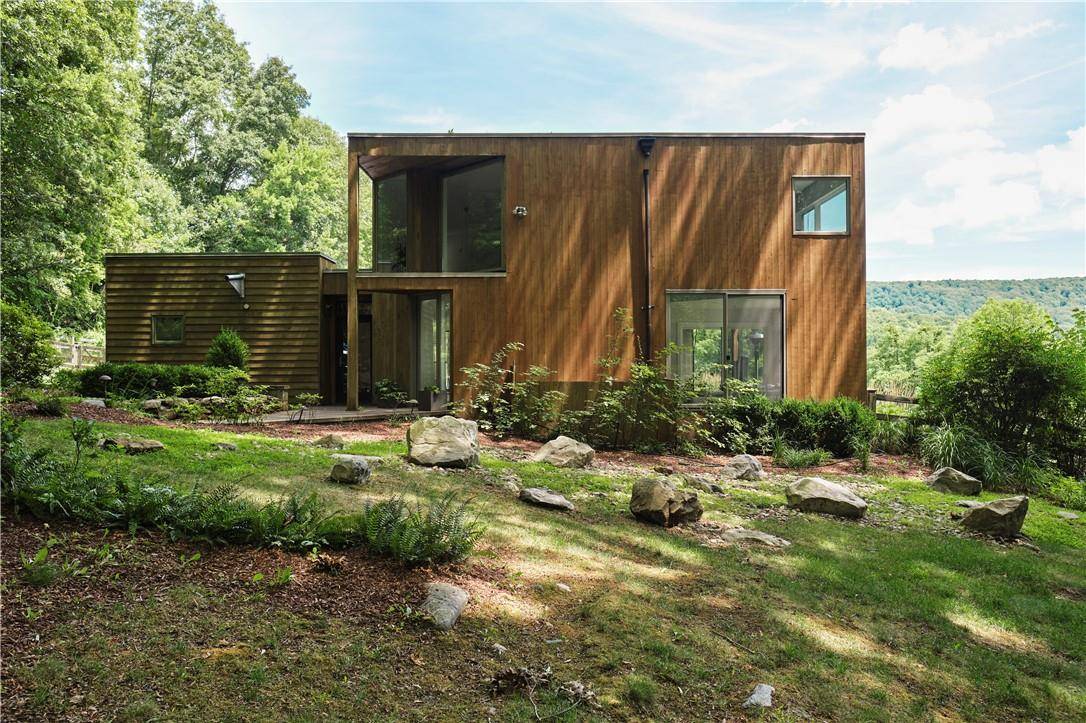 Stunning 3 bedroom, 2. 5 bathroom FURNISHED modernist home on 6 private acres with a gunite pool and breathtaking views.