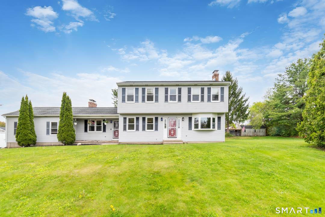 Beautifully maintained 4 bedroom Colonial set on a picturesque.