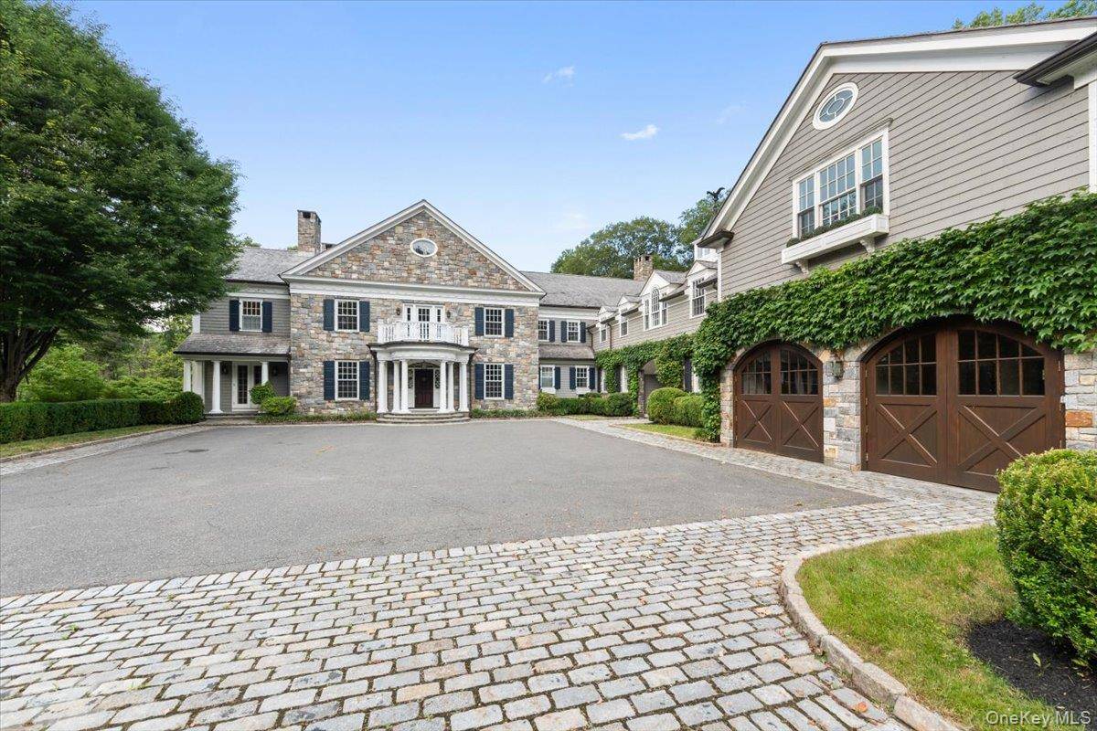 Nestled on 10 acres within the exclusive, guard gated community of Conyers Farm, this timeless stone and shingle manor offers a lifestyle of unparalleled luxury and resort style amenities.