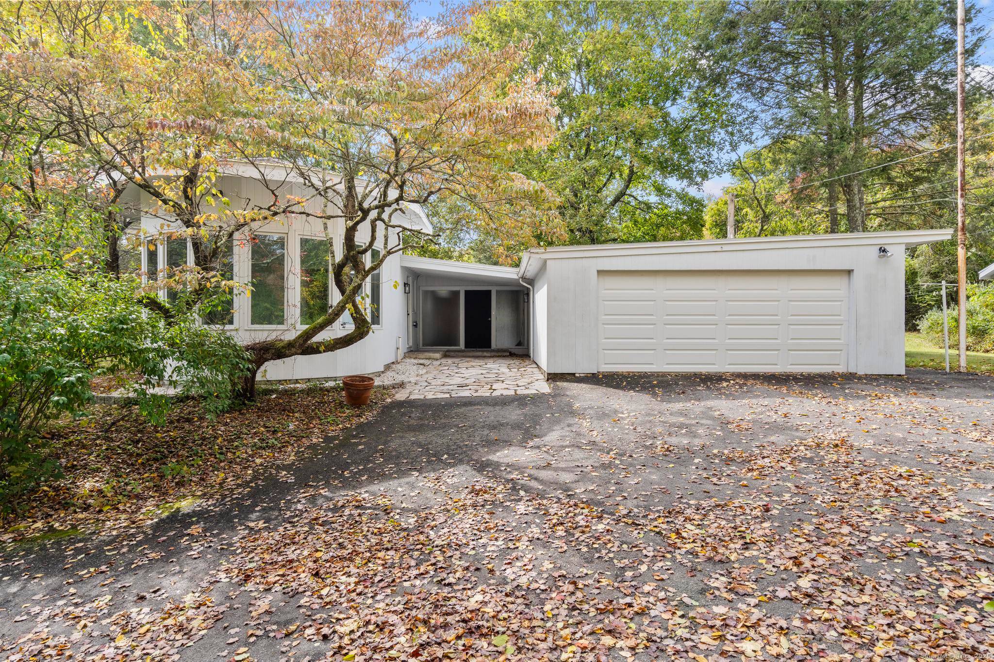 Step into this one of a kind mid century ranch, nestled in the heart of Monroe.