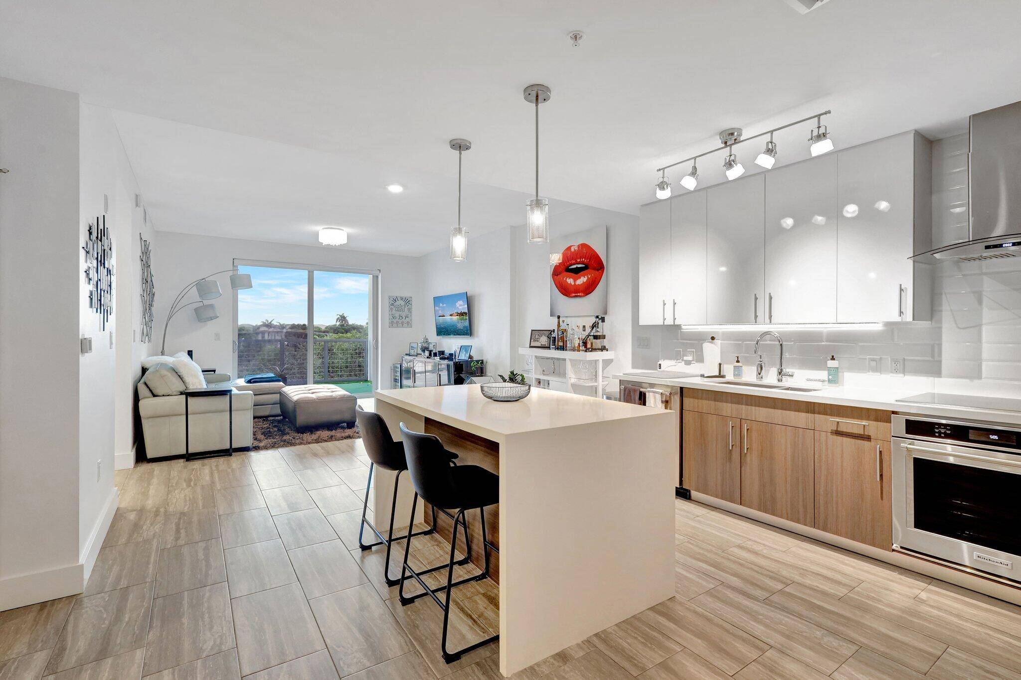 Welcome to this stunning, rarely available seasonal rental in one of Delray's newest luxury condo buildings, 236 Fifth.