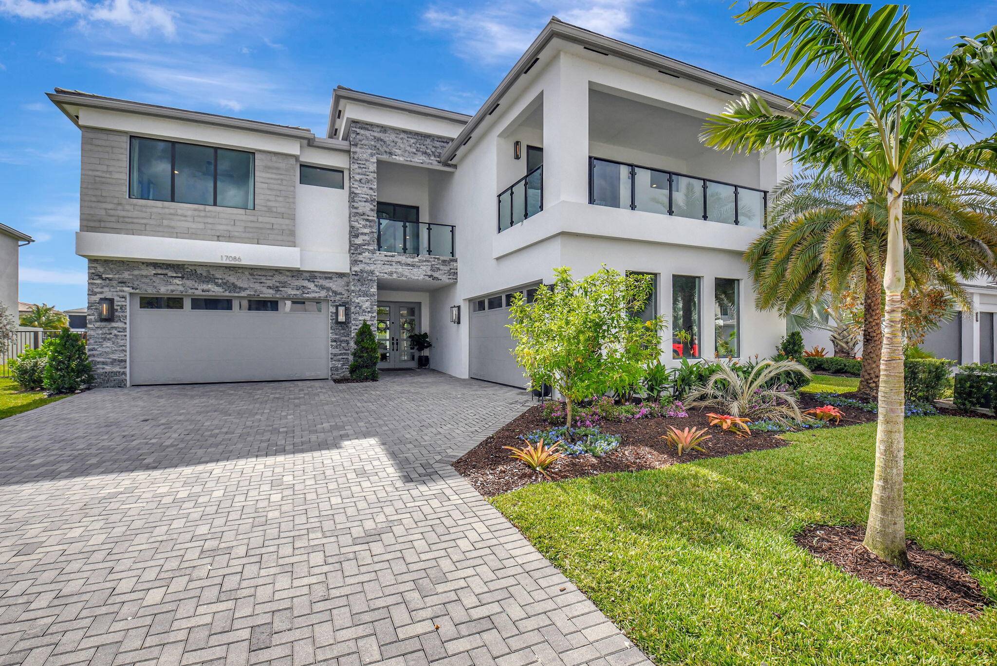 Experience unmatched luxury and design in the largest model home in Lotus, beautifully positioned on a private easement lot with an extra wide yard and stunning lake views.