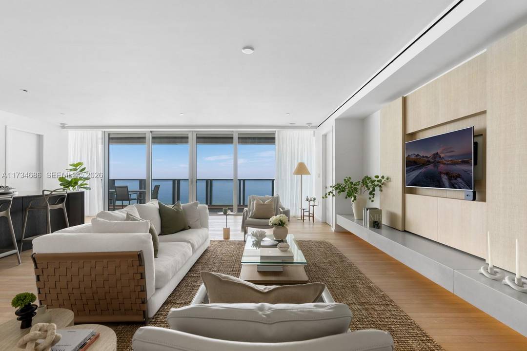 Experience unparalleled coastal living in this direct oceanfront home at The Edition Residences.