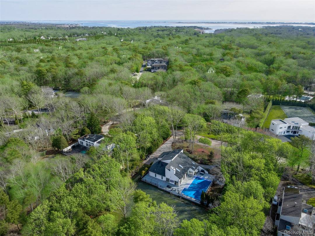 Ideally sited on a private one acre lot in one of the most desirable Hamptons villages, just minutes from the world renowned and highly sought after Quogue Village Beach, this ...