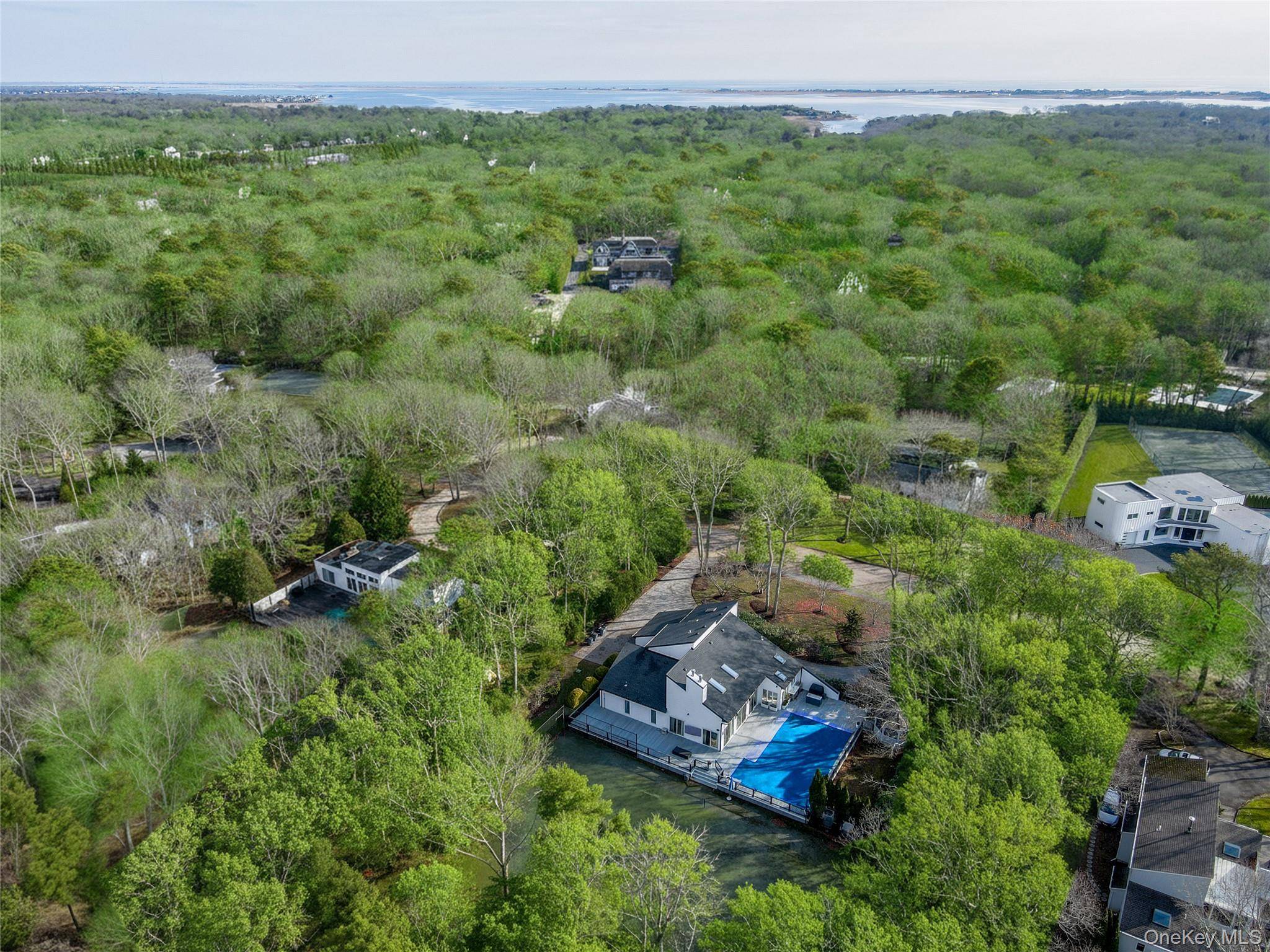 Ideally sited on a private one acre lot in one of the most desirable Hamptons villages, just minutes from the world renowned and highly sought after Quogue Village Beach, this ...