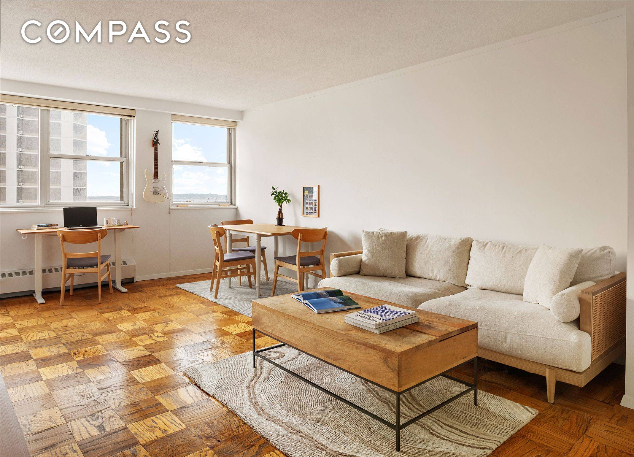 FURNISHED RENTAL Sun flooded, very high floor alcove studio with breathtaking Southern views of the East River and skyline is available for rent.