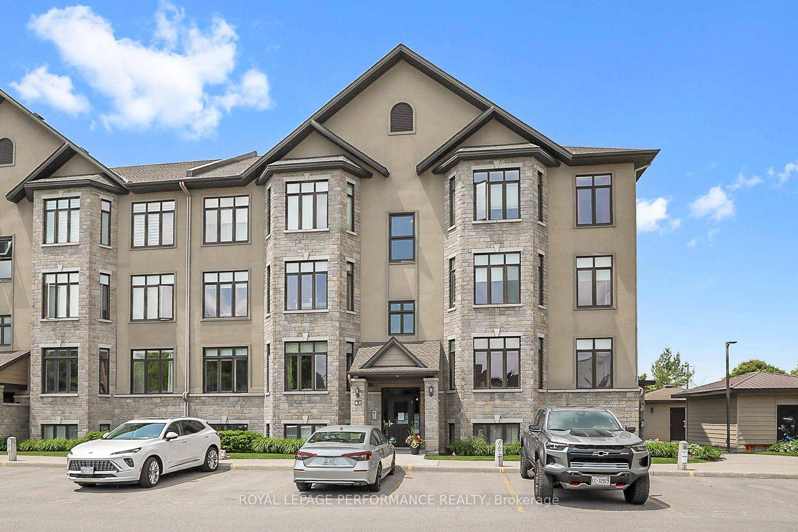 Bright and beautifully maintained, this sun filled corner end unit offers an open concept layout featuring hardwood floors throughout, a cozy gas fireplace, and in unit laundry.