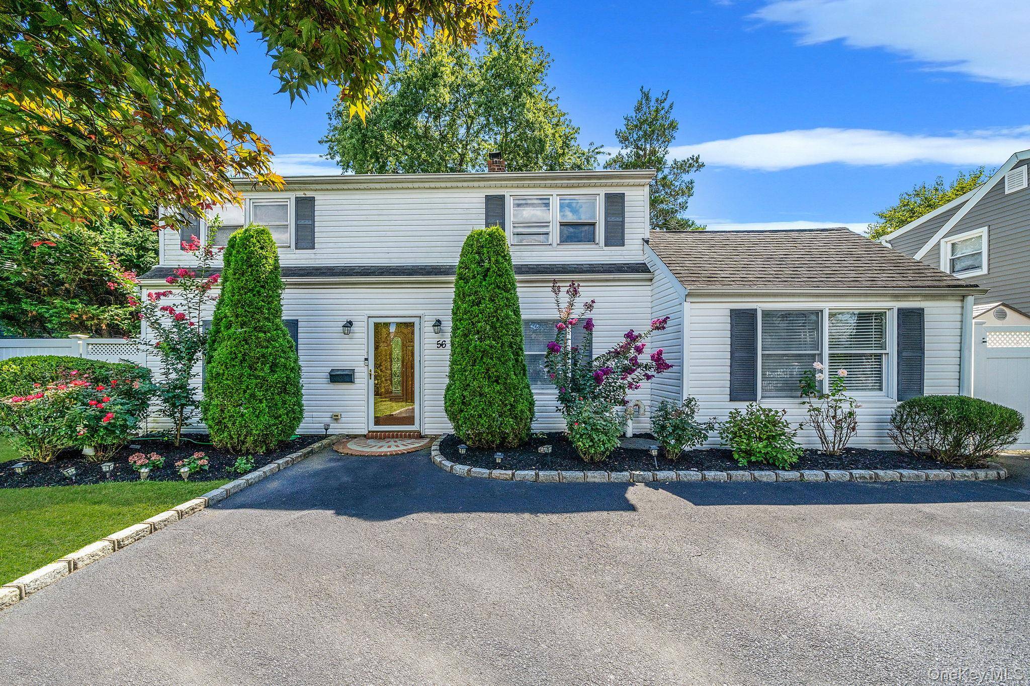 Welcome to 56 Cliff Lane a beautifully maintained 5 bedroom, 2 bathroom Colonial nestled in the heart of Levittown.