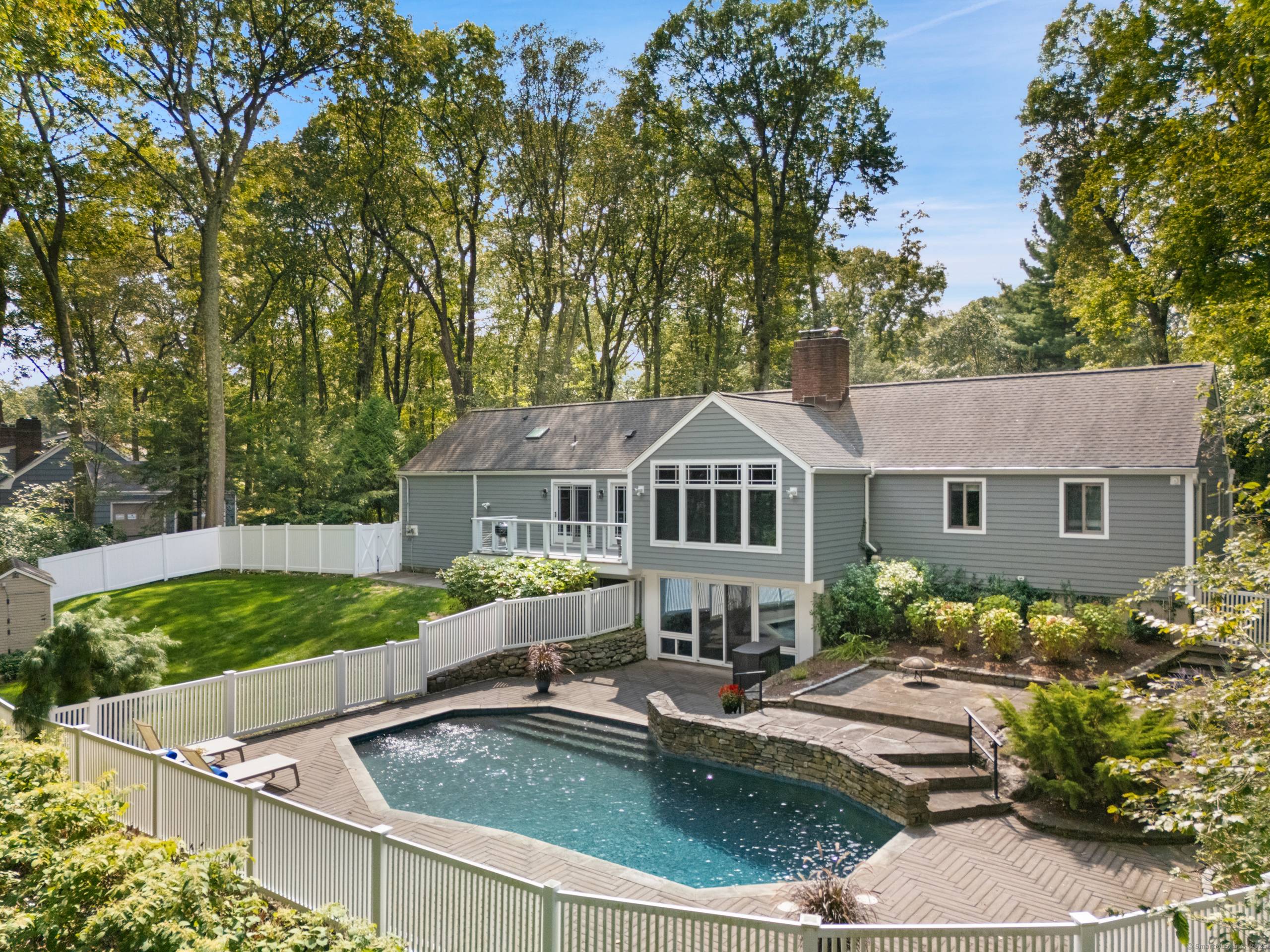 Discover sophisticated single level living in this stunning 3, 300 square foot ranch, privately set on over an acre with stone walls, heated gunite saltwater pool, and irrigation system.