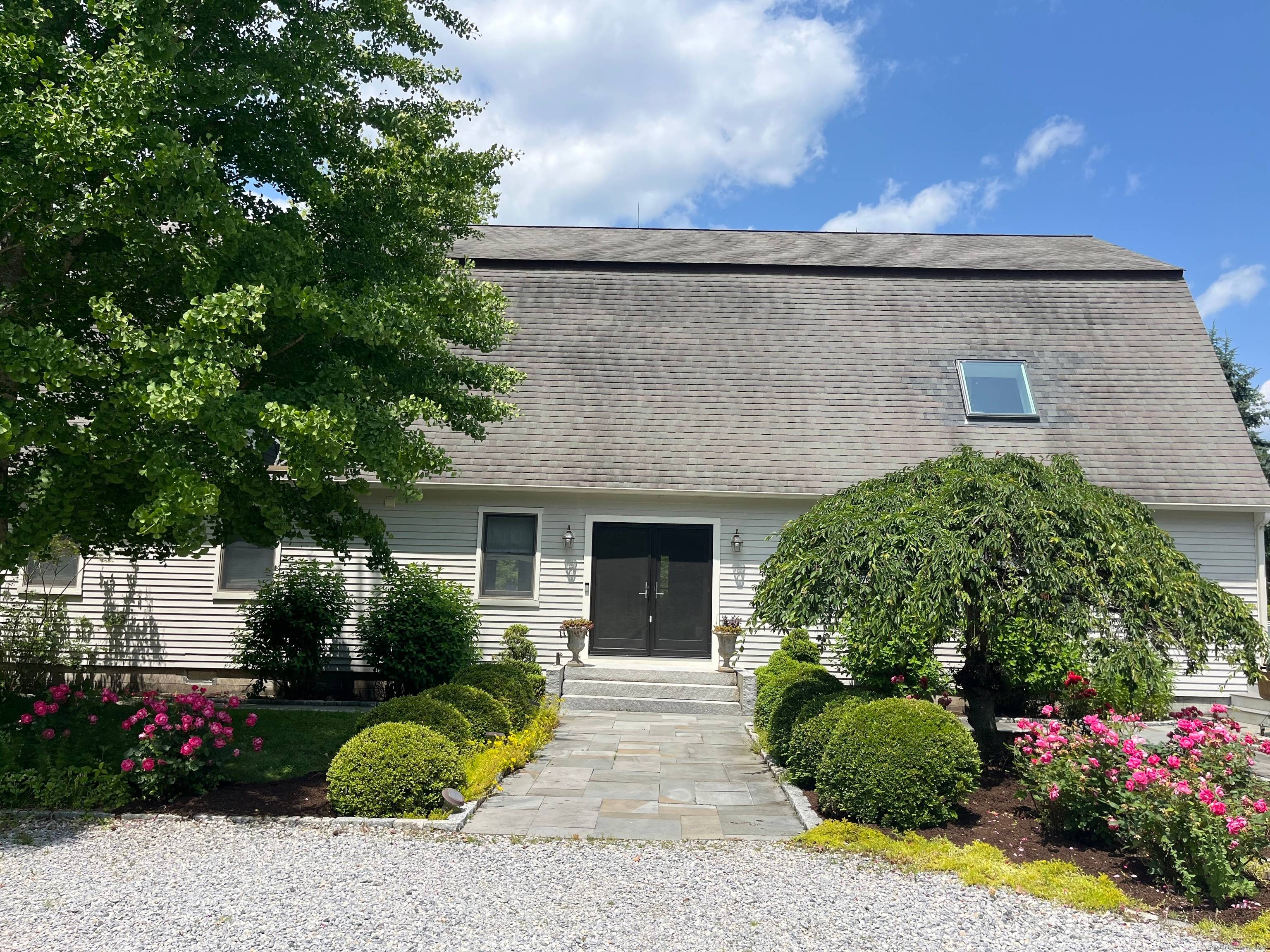 Rich architectural details, modern amenities and water views create a captivating atmosphere in this 1910 renovated barn.