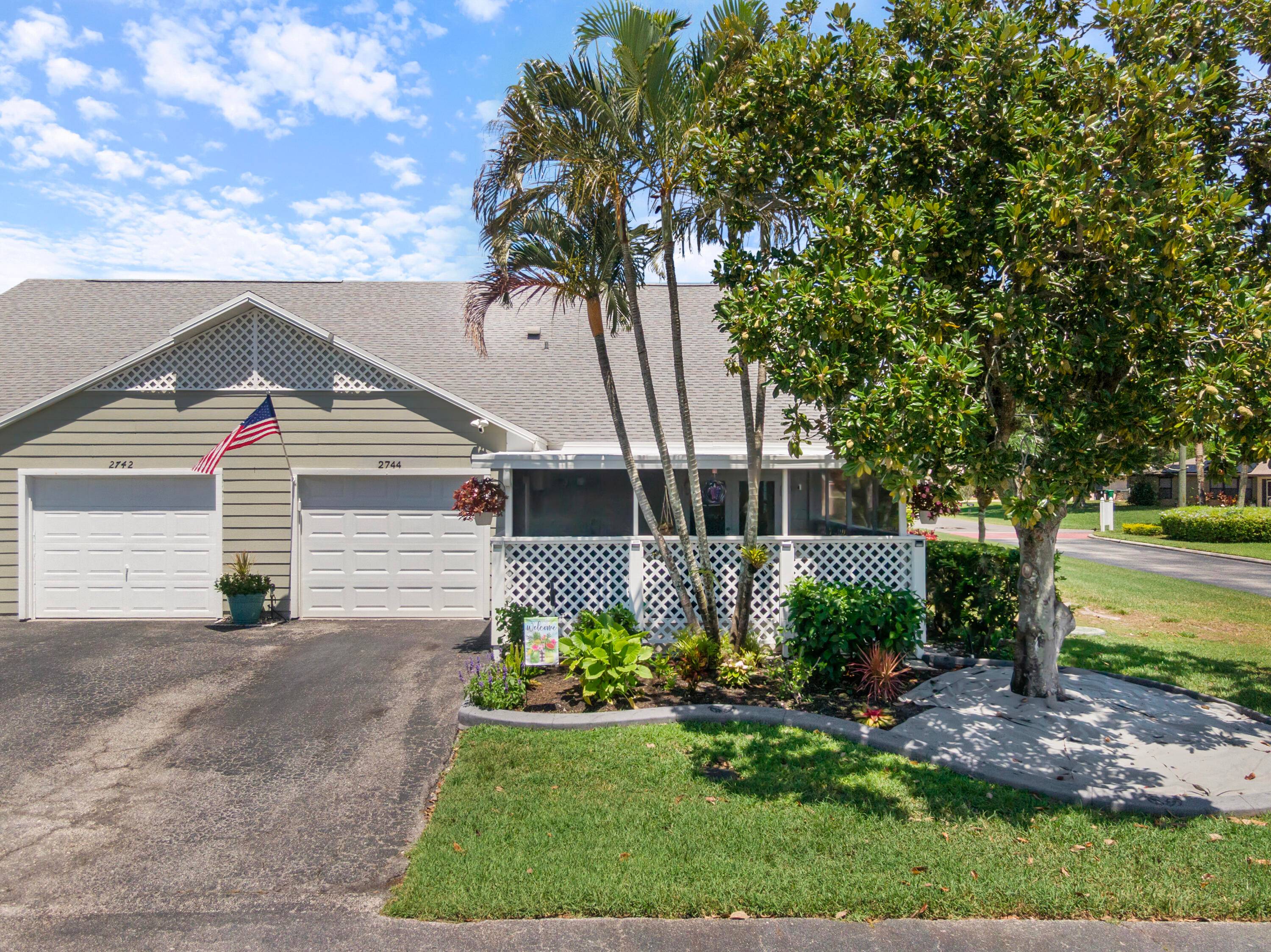Discover this beautifully maintained 2BR loft, 2BA, 1CG villa on a corner lot in quiet, desirable Tropical East.