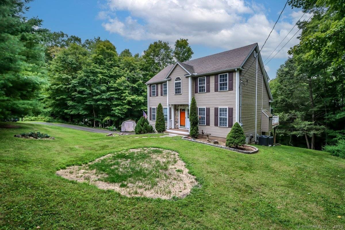 Spectacular marvelously maintained colonial perched high above quintessential downtown New Milford.