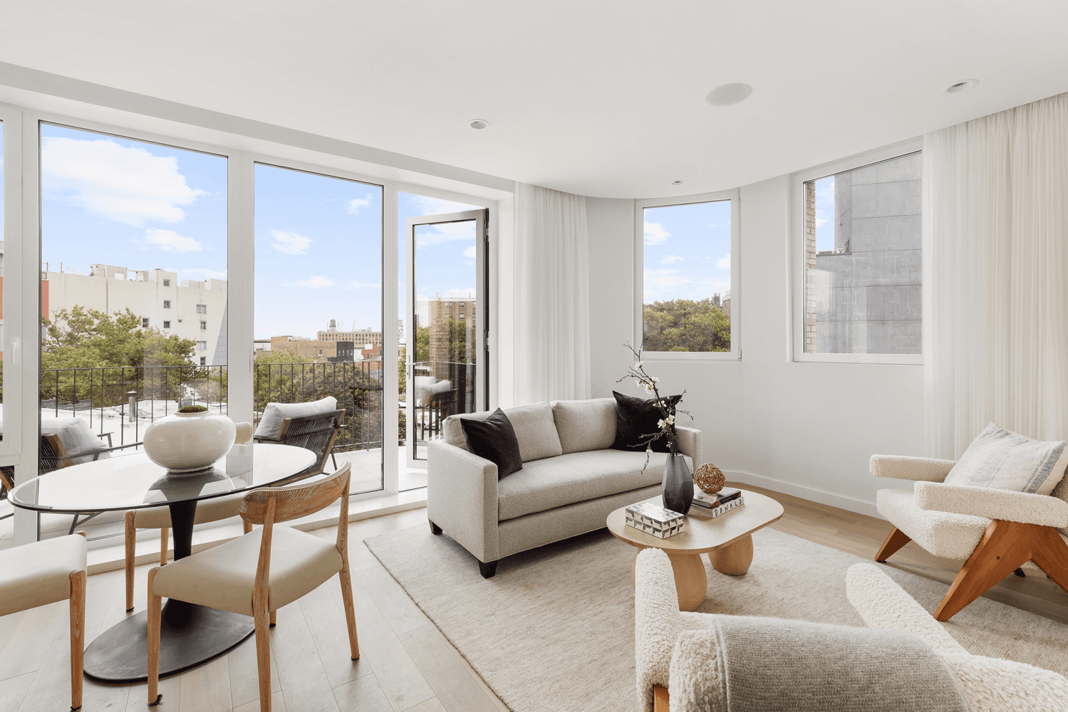 Welcome to this exquisite penthouse with a balcony AND stunning private rooftop terrace at The Woodpoint in Williamsburg.