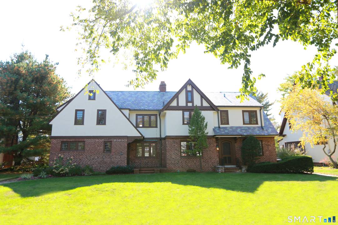 Exceptional opportunity to own a distinctive 1925 Tudor Revival Duplex in a highly desirable location.
