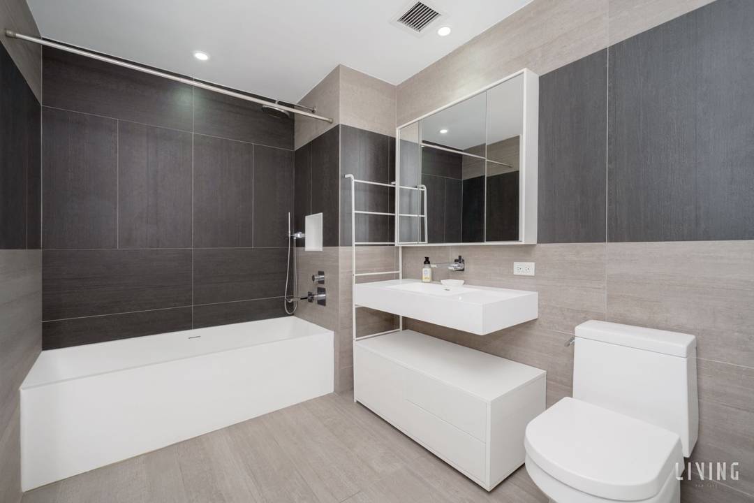 Experience dramatic loft style living in this stunning duplex one bedroom, two bathroom residence at 540 West 49th Street.