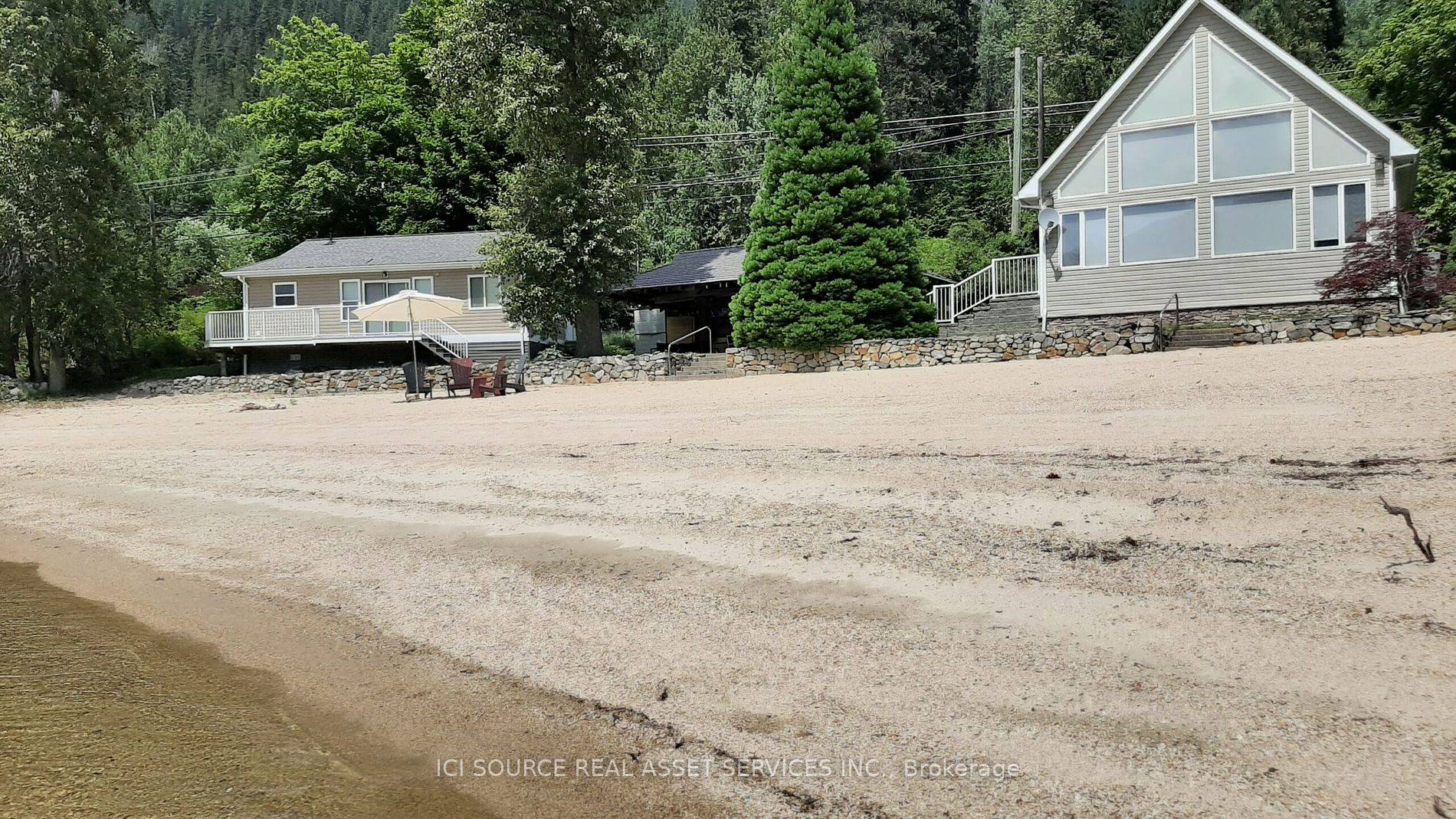 7 Miles from Nelson BC on Kootenay Lake, this 10 acre property has it ALL Beach, Forest, Creek, Garden.