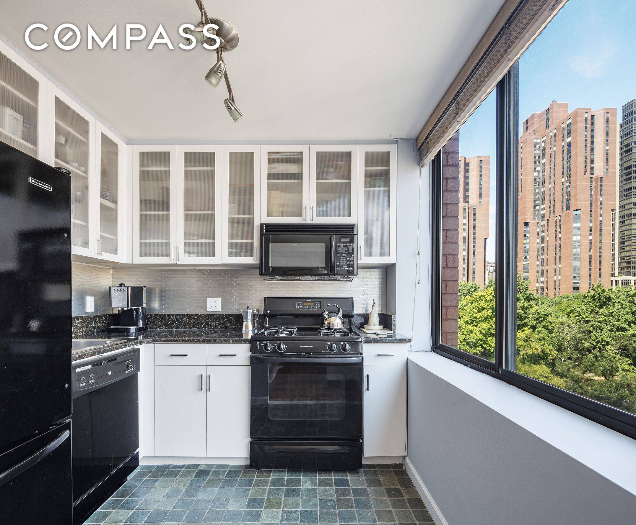 Sunny, quiet and spacious 1BR home office duplex condo with a wood burning fireplace.