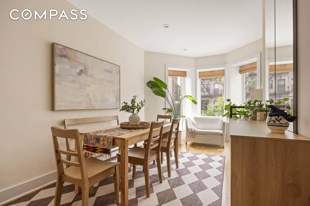 Bright, Elegant Garden Duplex with Private Backyard and Plentiful Storage This garden duplex offers warm, light filled living and dining spaces with charming bay windows and natural finishes throughout.