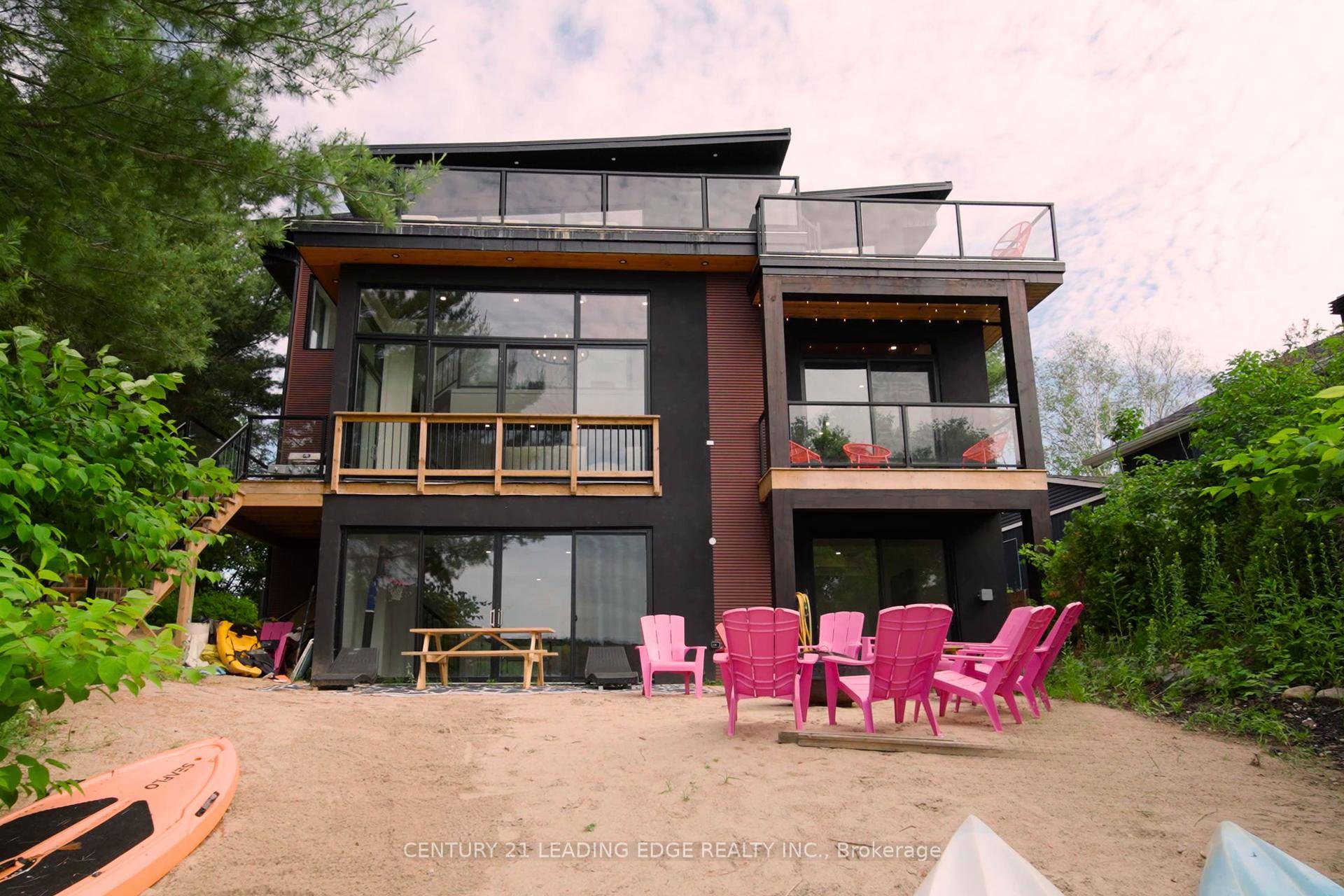 Welcome to 34 Ottawa Avenue, an extraordinary newly built waterfront retreat nestled on the pristine shores of Forest Lake in the charming community of South River in Parry Sound.