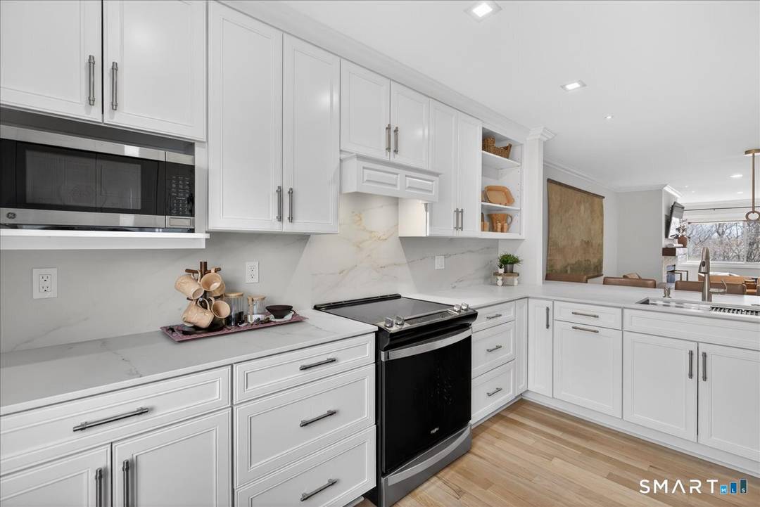 In the heart of Madison, discover this exceptional 3 bedroom, 3 full bath condo that has been completely updated from top to bottom right down to the door knobs.