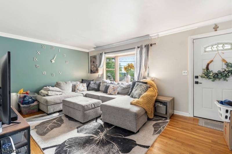 Welcome to 46 Pershing Place, a thoughtfully updated home offering modern comfort, flexible living space, and a highly convenient Woodland Park location.
