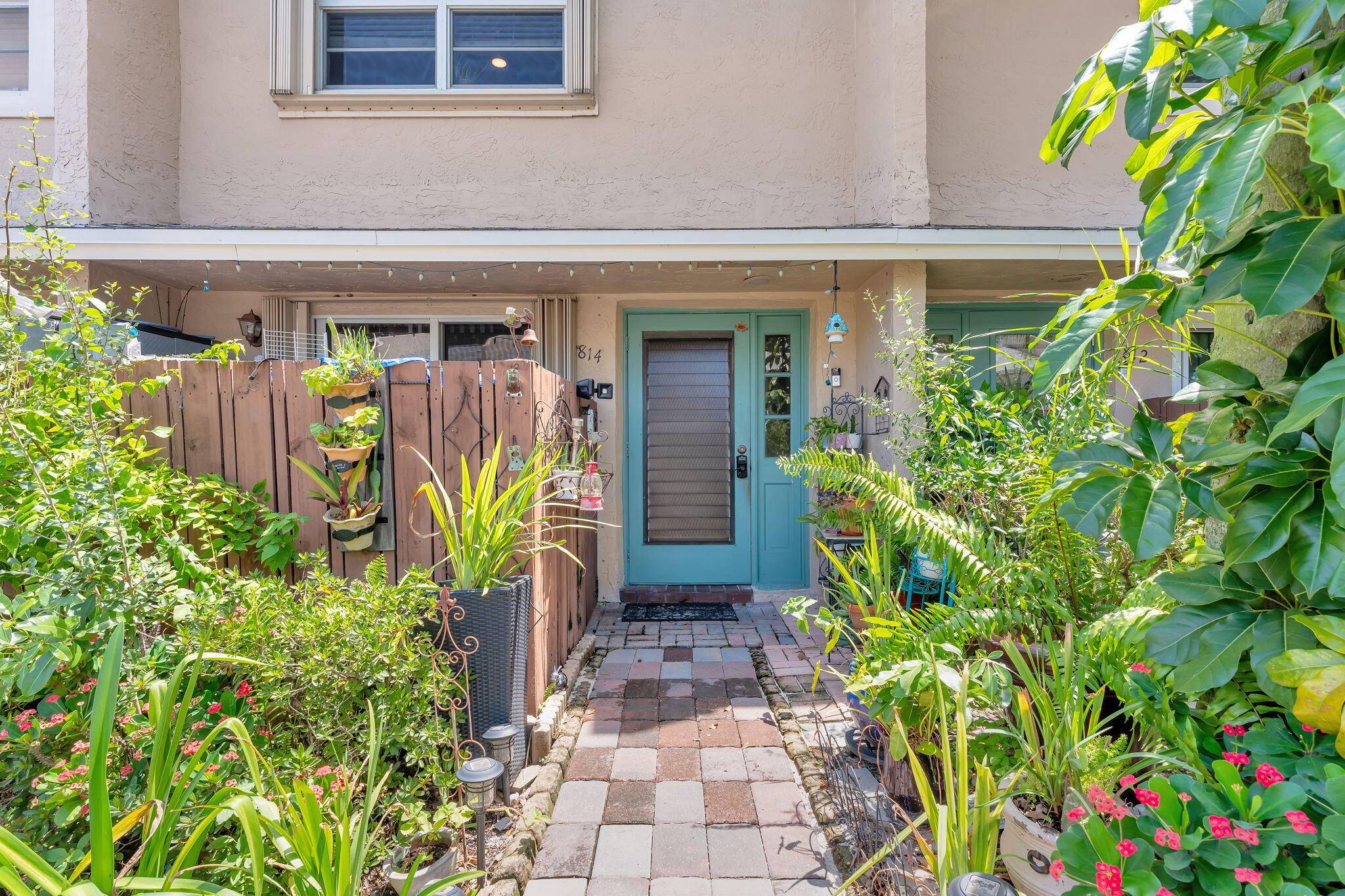 Two Bedroom and 1. 5 Bathroom Lakefront Townhome on Elevated Lot, With Two Private Patios, In Woodlake Villas in Coconut Creek.