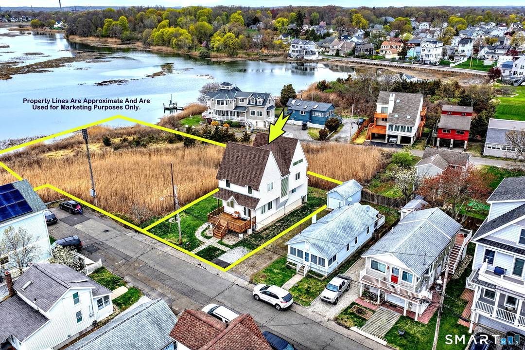 Experience coastal living at its finest in this custom, sun filled warm home offering breathtaking sunset views over the Housatonic River tidal marsh.
