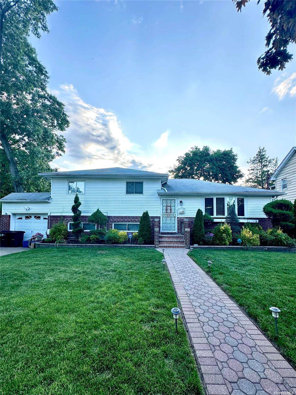 This split level apartment features three bedrooms, a full bathroom, a cozy living room, and an elegant formal dining room.