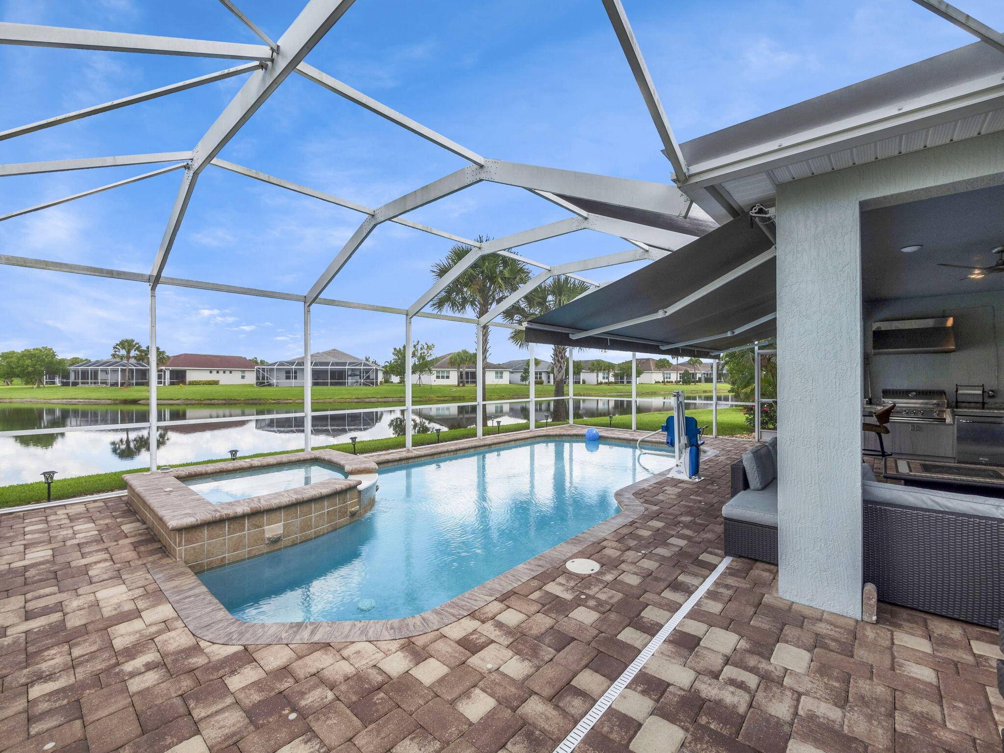 Waterfront, POOL Jacuzzi home on an oversized PIE SHAPED lot in the beautiful 55 Del Webb at Tradition this one is a MUST SEE !