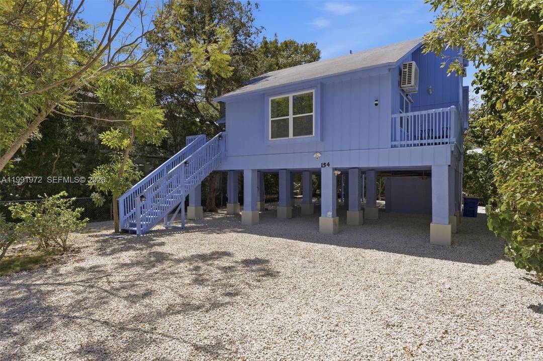 Blue Haven is a beautifully renovated elevated 2 story residence in the heart of Islamorada, offering the ideal blend of modern upgrades and relaxed Florida Keys living.