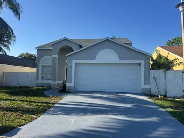 Spacious 4 bedroom, 2. 5 bath single family home with a 2 car garage, located in Boynton Lakes with low HOA fees.