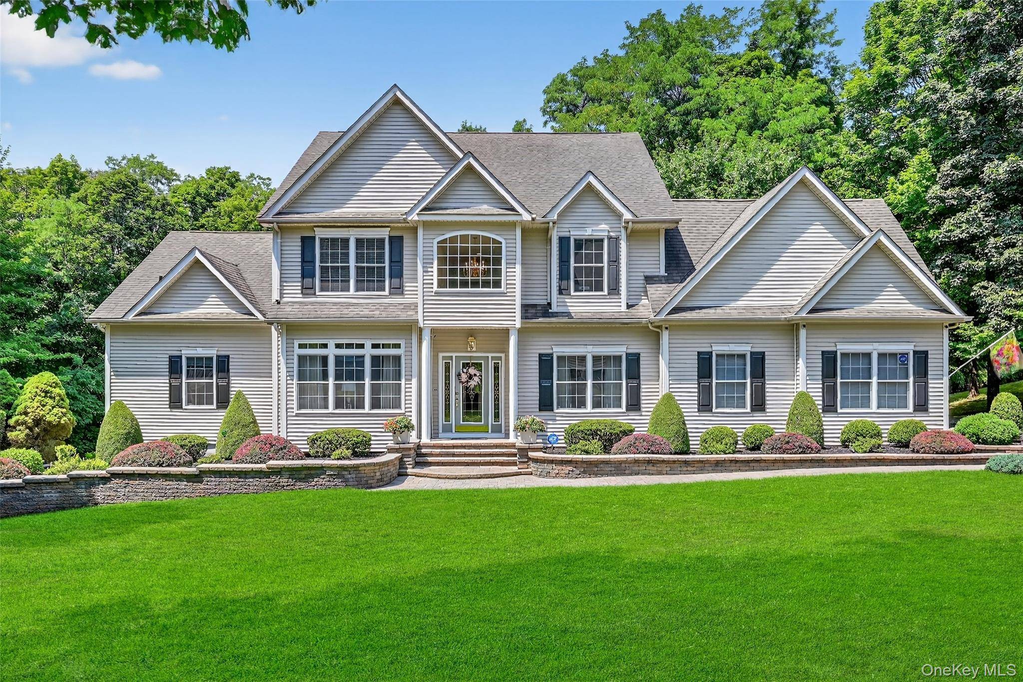 Step into elegance ! This exceptional and sophisticated custom home sits on a tree lined street in one of Balmville's most coveted neighborhoods.