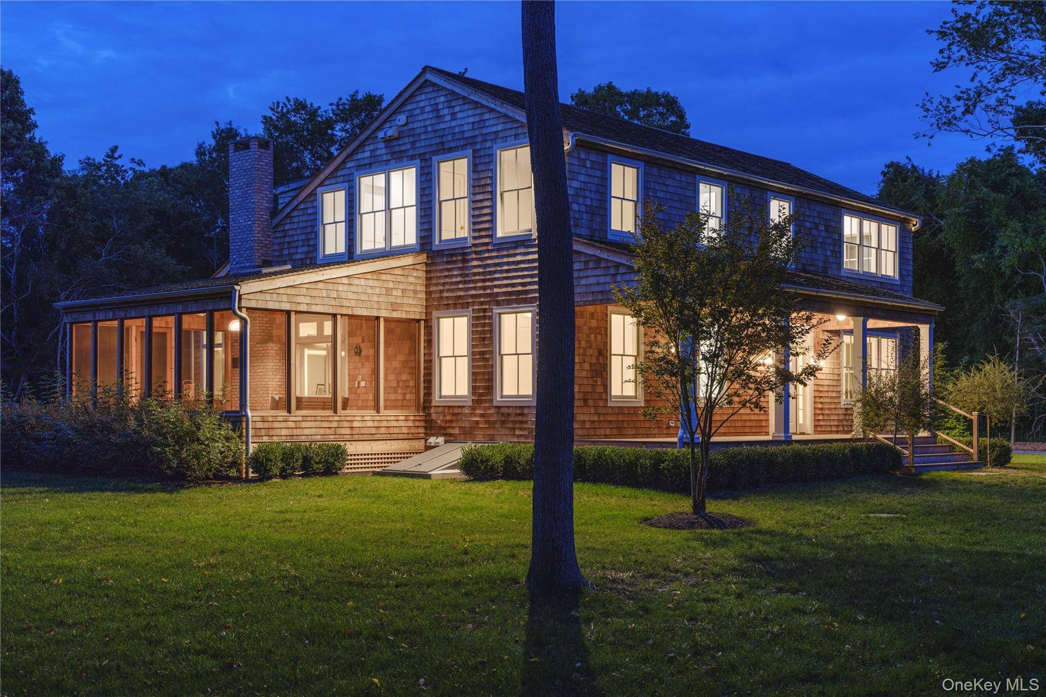 Located on picturesque Park Avenue in Mattituck, this bespoke new construction sits on a generous 1.
