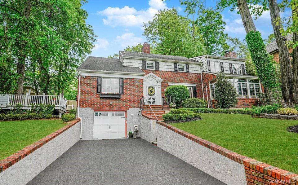 Elegant Colonial with Panoramic Views on Lighthouse Hill This stunning 4 bedroom brick Colonial perfectly blends timeless elegance with modern comforts.