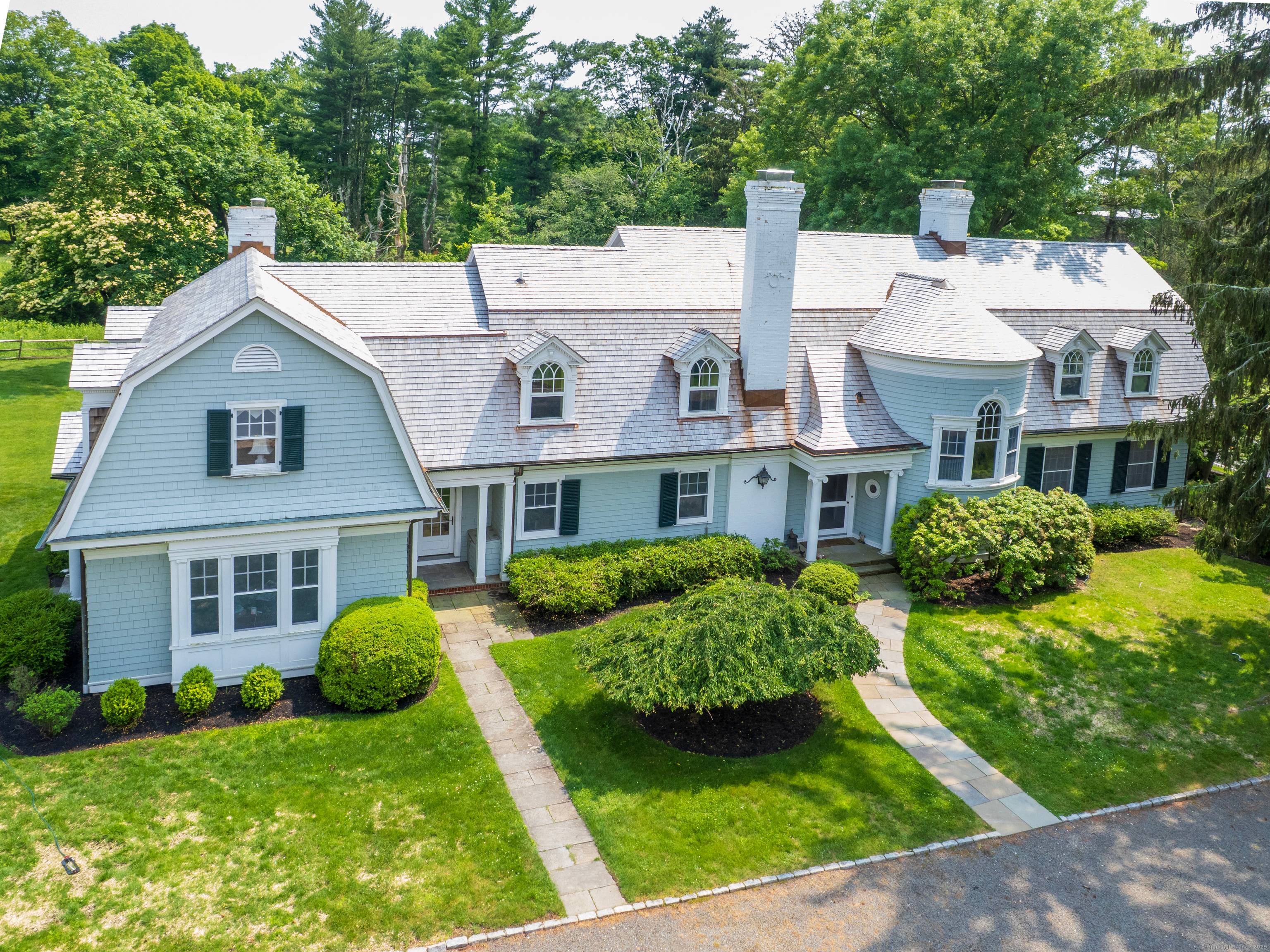 THE BEDFORD HOUSE Architecturally and historically significant estate in coveted Greens Farms.