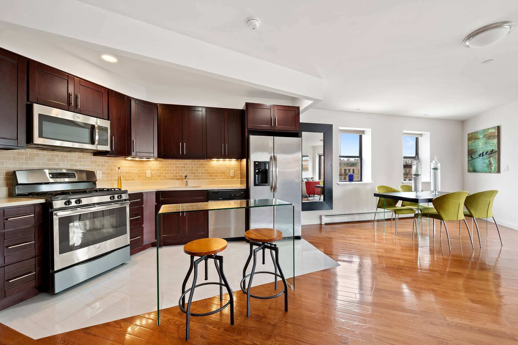 This spacious, rarely available corner apartment is well laid out with two large bedrooms, two full bathrooms, an open kitchen plan, and no shortage of sunlight.