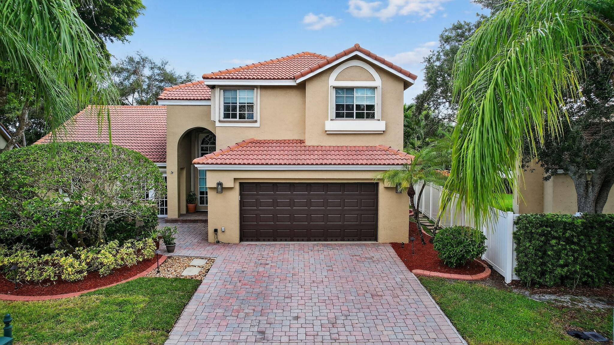 Step into serene living in Laguna Springs, one of Weston's most desirable gated communities with just 142 homes.