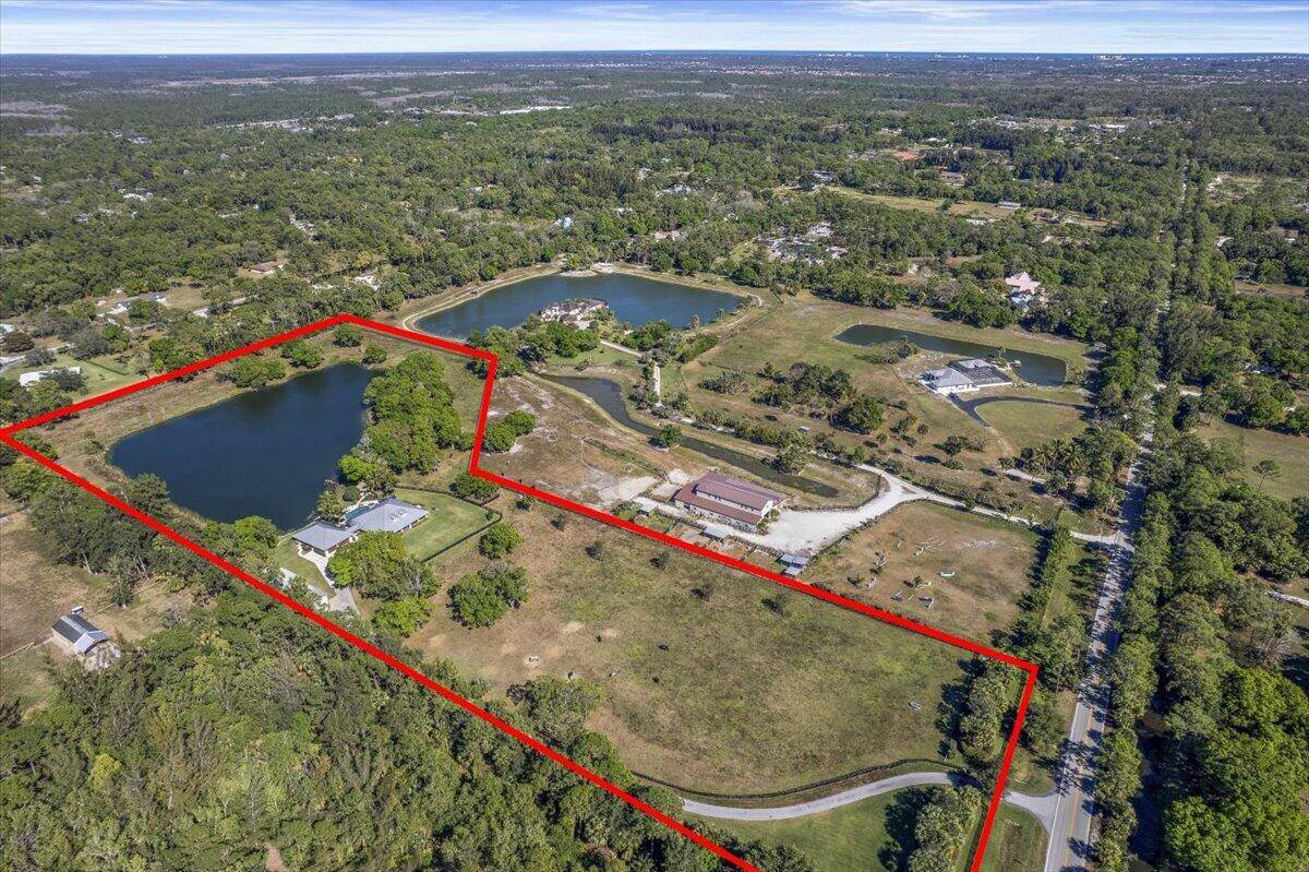 A rare 12 acre private estate offering exceptional luxury and tranquility just minutes from Jupiter's beaches.