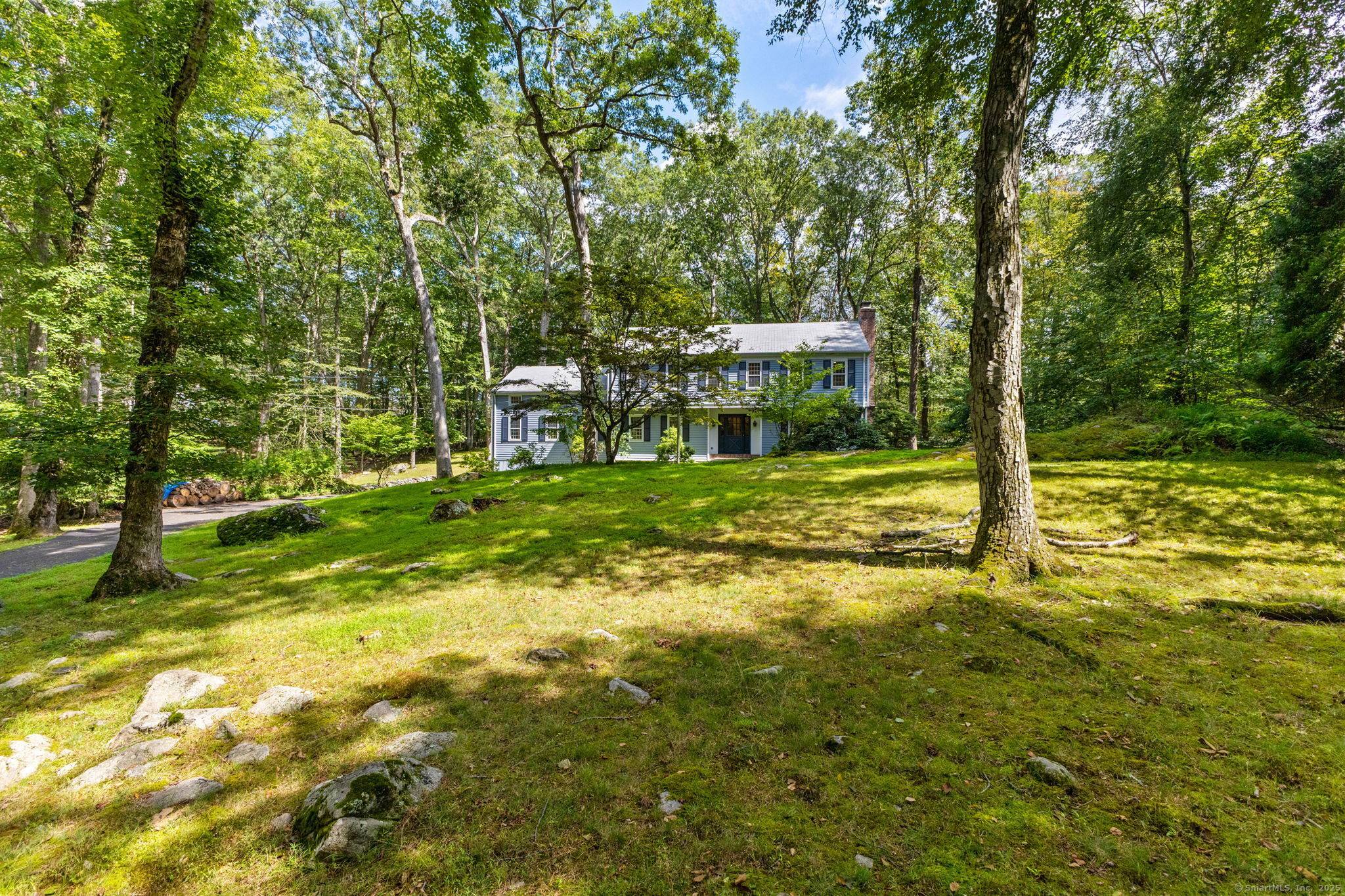 Nestled on a quiet cul de sac and set back from the road, this sprawling 4 bedroom colonial offers the ultimate in privacy and tranquility.