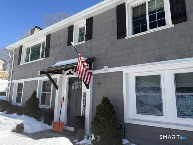Welcome to this stunning 5 bedroom raised ranch in Orange, Connecticut !