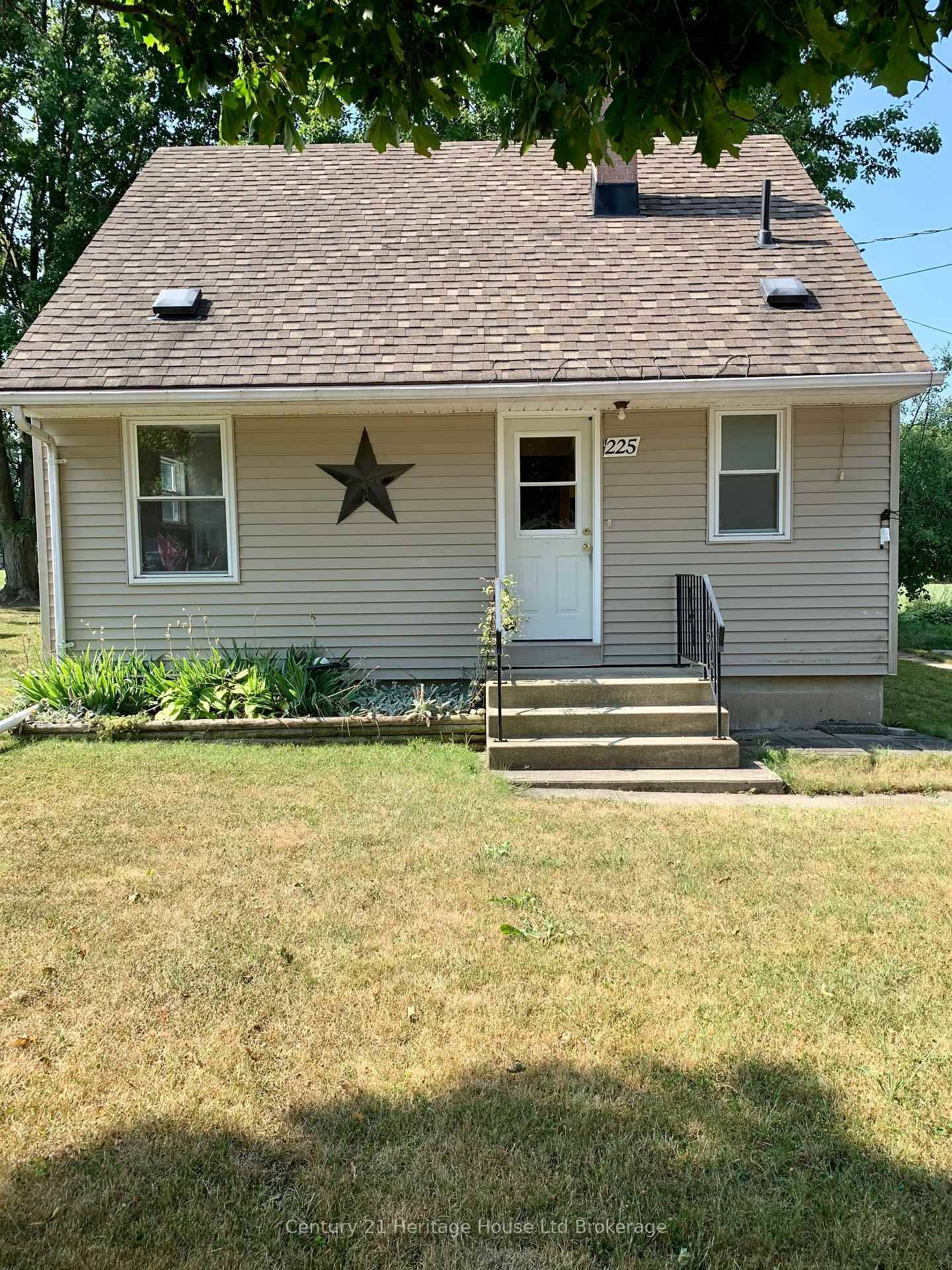Very Cozy 1 1 2 storey home in a park like setting featuring 3 bedrooms with the primary bedroom on the main floor.