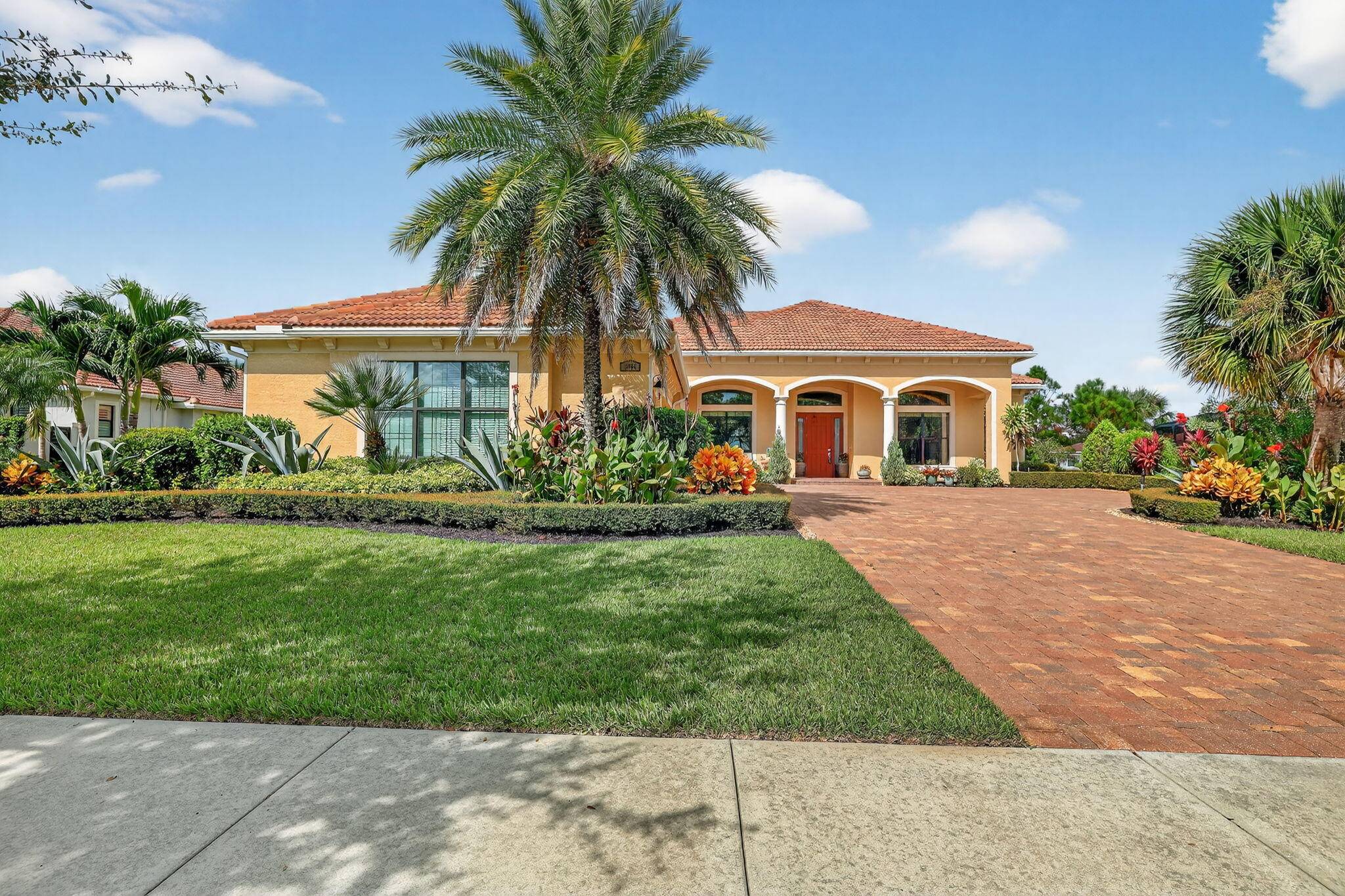 Elegant 4 bedroom, 4. 1 bathroom home with an office, located at 2960 SW English Garden Dr in the prestigious Canopy Creek community by Kolter Builders.