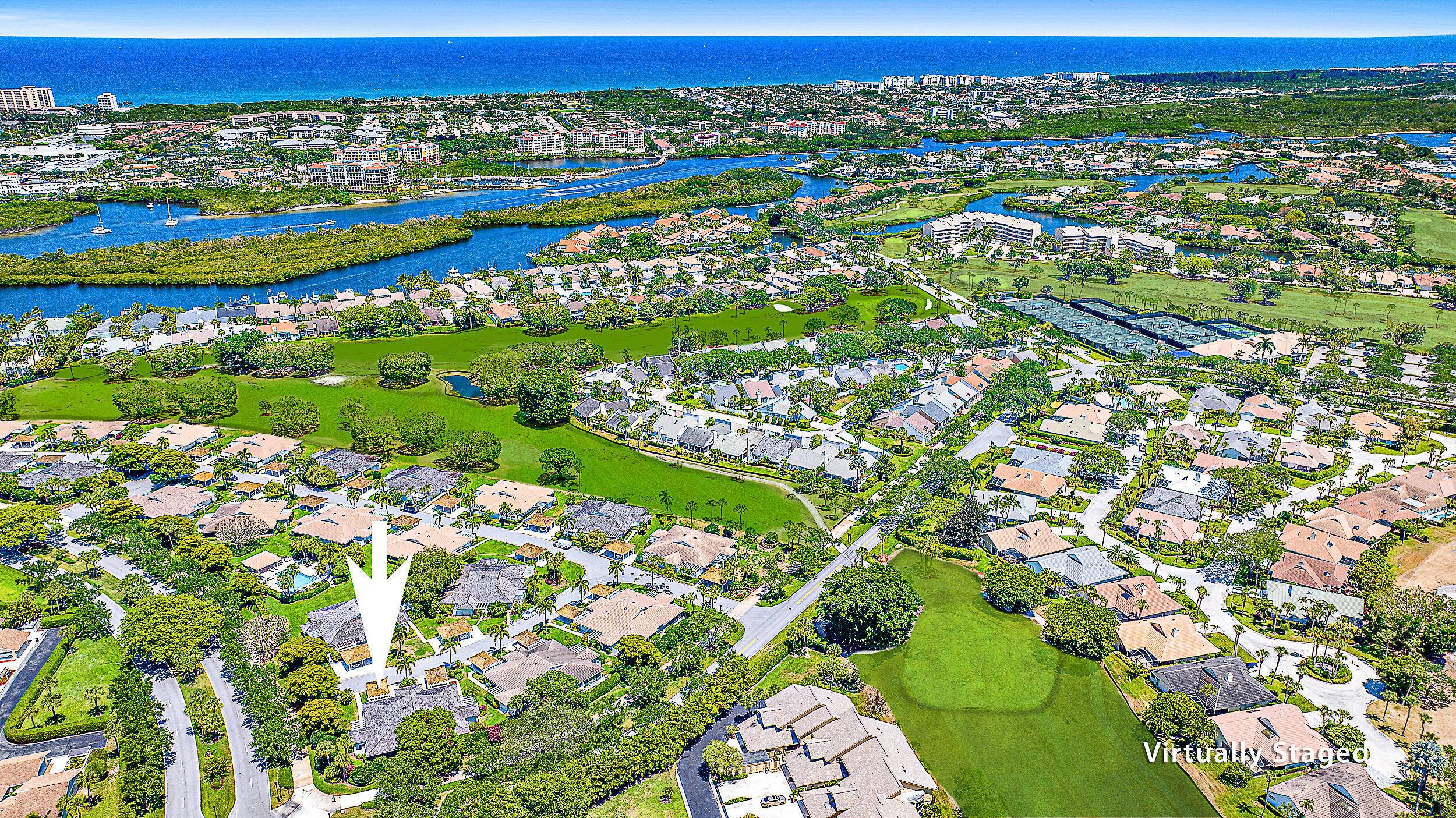 Enjoy the desirable gated community of Jonathan's Landing in this exquisitely remodeled golf villa.
