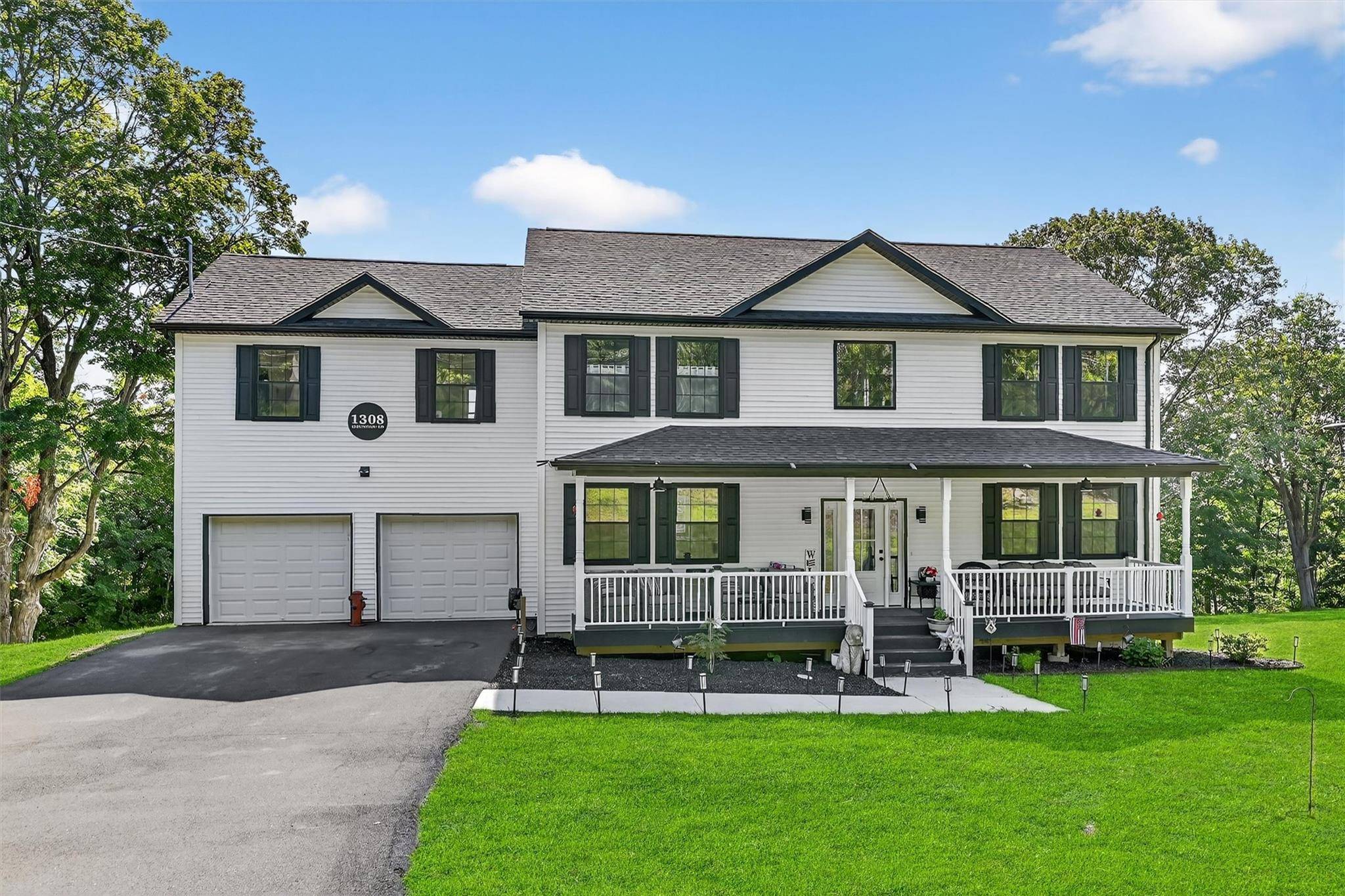 Welcome to this stunning 4 bedroom, 3 bathroom colonial home nestled on a serene 1.