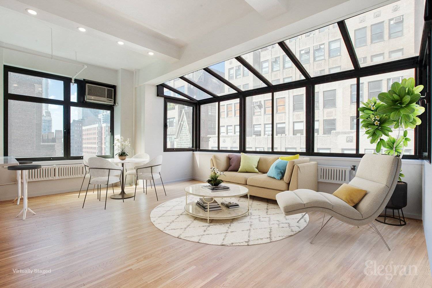 LOVE THE LIGHT Entertaining, lounging, and dining couldn't be better than in this extraordinary loft with 11ft ceilings and a living room that features a solarium bathed in sunlight.